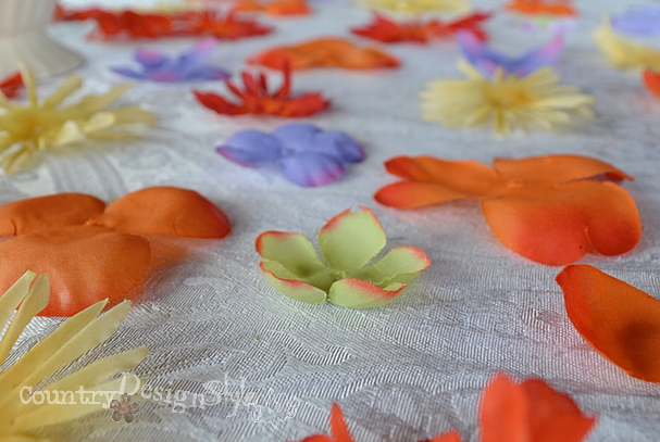 close up of scattered flowers http://countrydesginstyle.com #silkflowers #tablescapes #simplepartyideas