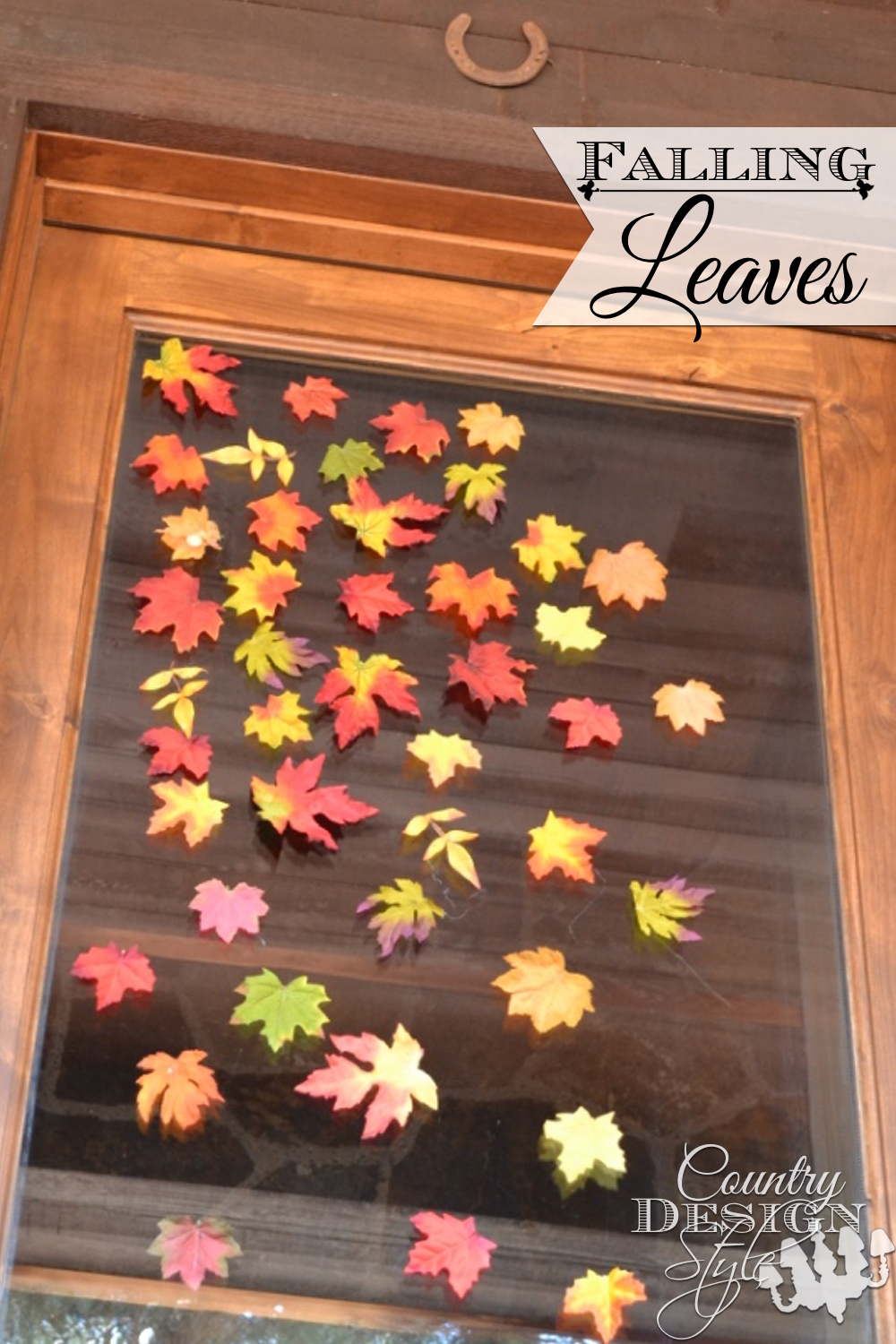 Do you dare to hot glue silk leaves to your glass door? I did this early fall decor with the leaves in the bottom of the fall decor crate. Country Design Style www.countrydesignstyle.com