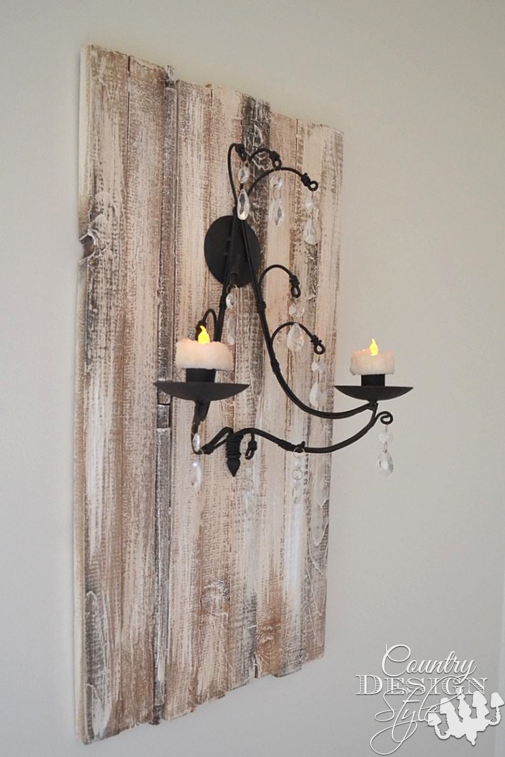 Rustic plaque made from wood planks add importance to simple candle sconce. Country Design Style