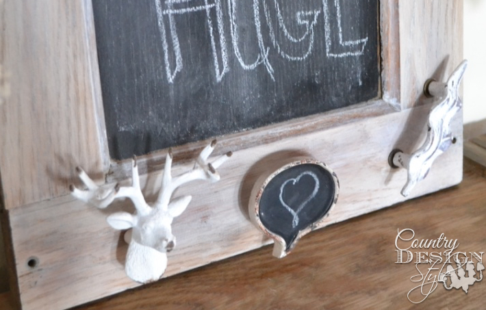 Old organ reclaimed wood piece becomes a chalkboard with countersink holes, draw pulls screw sticking out too far. Plus how to add drawer knobs as hooks on a board and still lay flat against the wall!! | countrydesignstyle.com