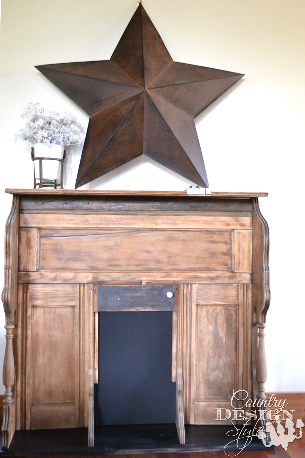 Organ makeover into faux mantel decorated with large metal star and vase of babies breath. The firebox area is CHALKBOARD. PIANO or ORGAN KEYS are designed into the top. | countrydesignstyle.com 
