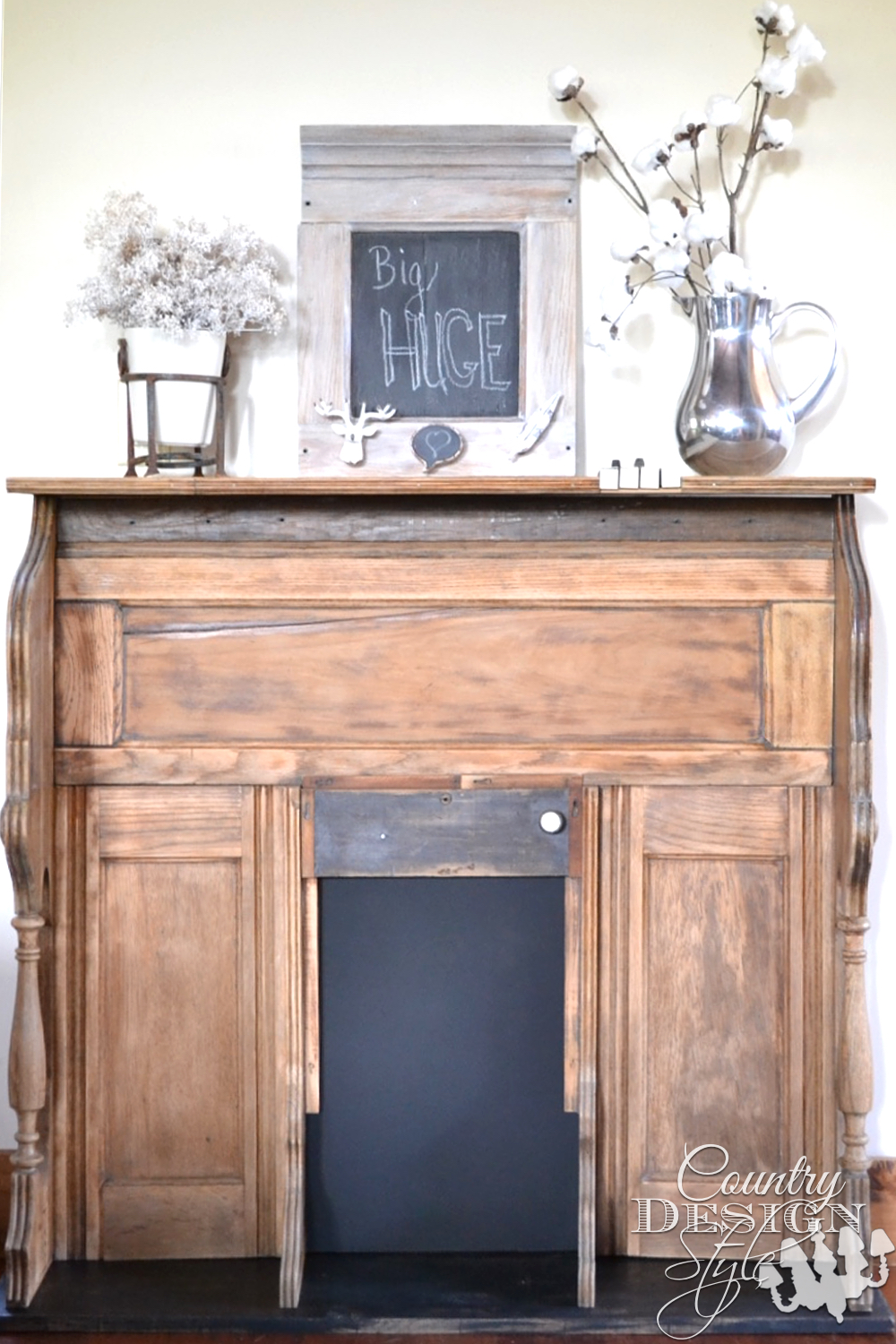 Organ remade into faux mantel with tutorial for inserting piano keys into top, chalkboard in firebox. Displayed with DIY cotton stems. | countrydesignstyle.com 