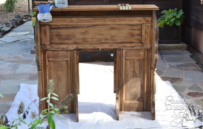 Pieces of an old organ turning into a faux mantel. The wood was waxed to clean and perserve | countrydesignstyle.com