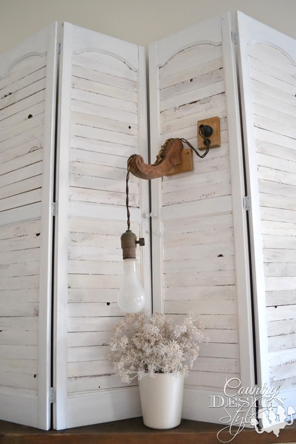Vintage Styled Lighting. Not great to read by, but a fun prop. Wooden bracket and cloth cord. | countrydesignstyle.com