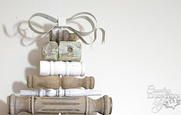 Christmas tree in vintage style made with old spindles the metal ribbon bow. | countrydesignstyle.com