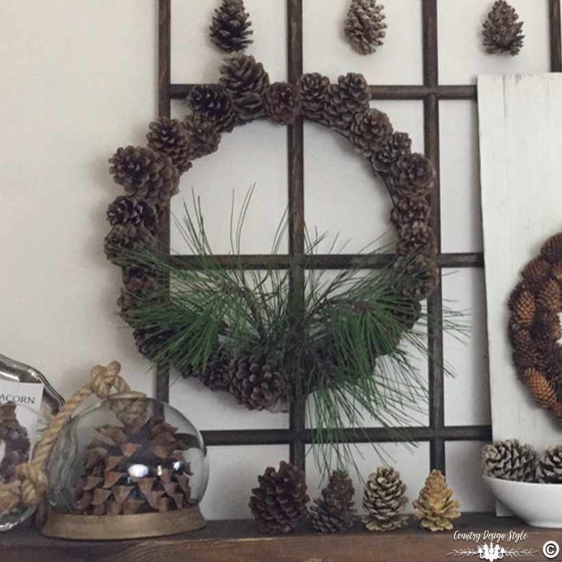 blooming-pine-cone-wreath-on-window-frame-country-design-style-countrydesignstyle-com