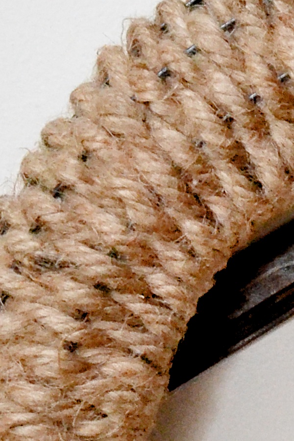 Closeup of rope woven on wire frame