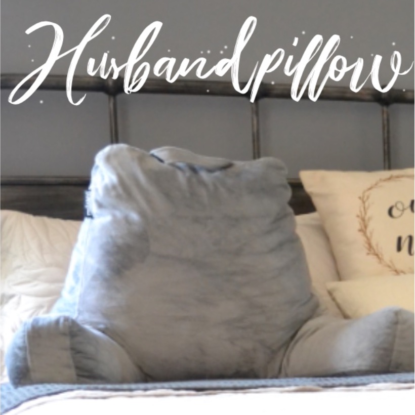 Gray husband pillow sitting on bed