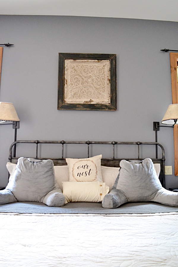 king size bed with two gray pillows