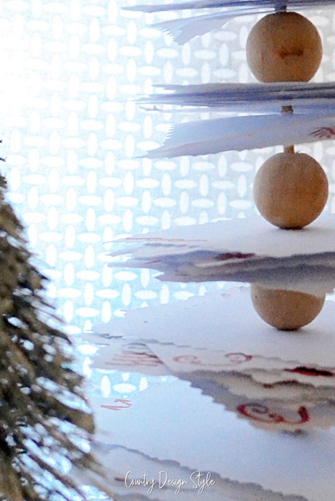 close up of wood beads in paper tree