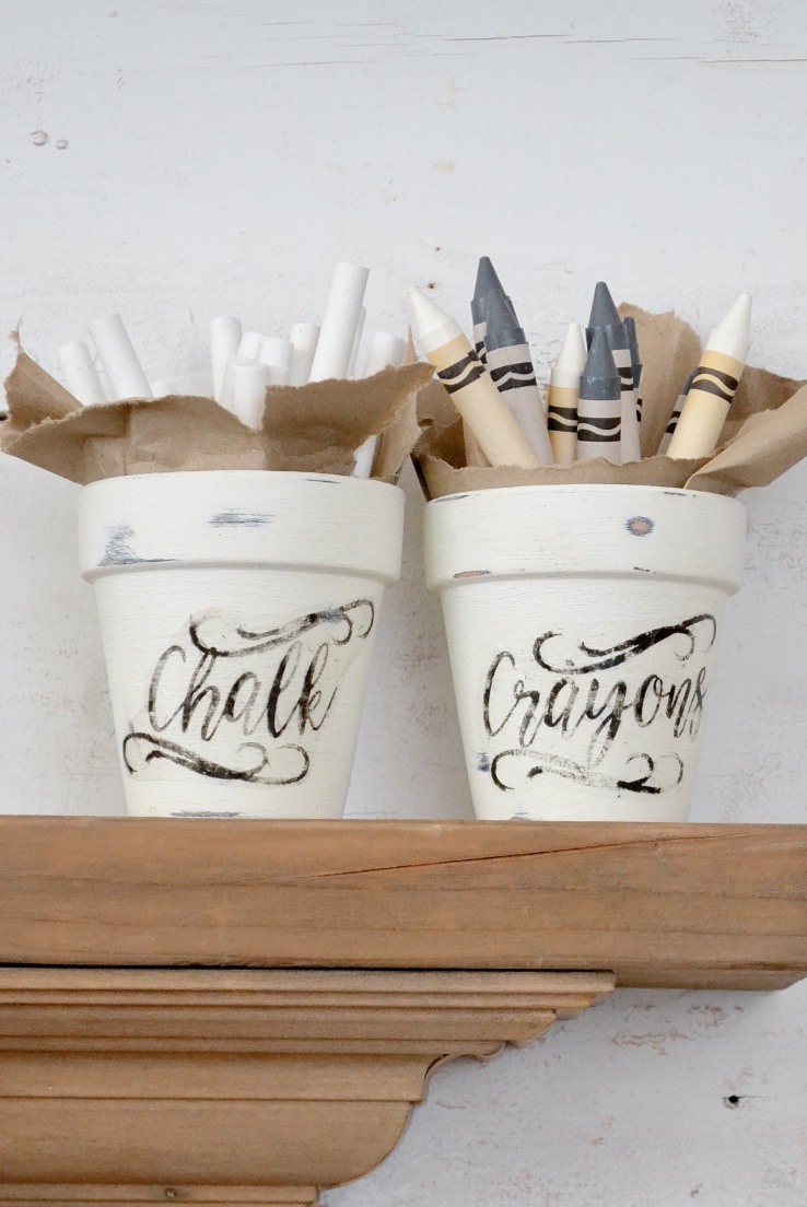 clay pots with crayons and chalk